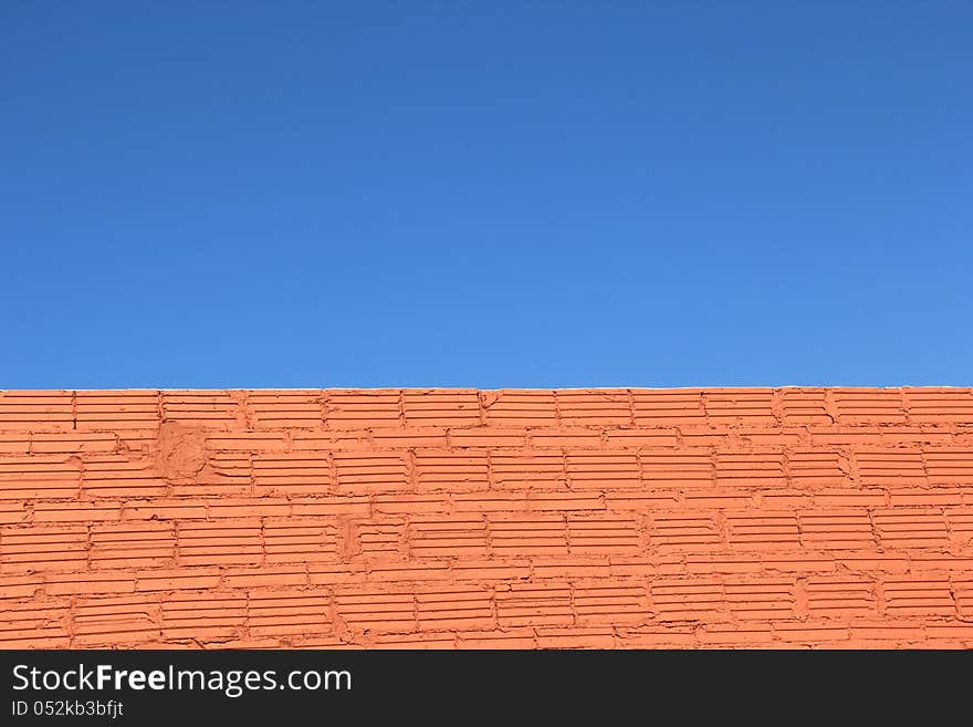 Clear blue sky brick wall