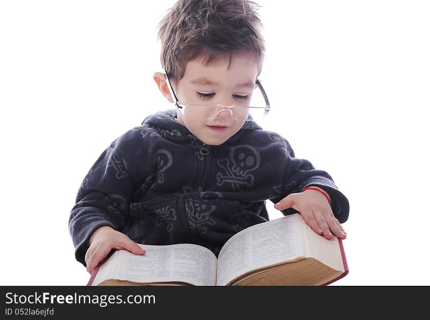 Little boy with big glasses readng a big book on white background. Little boy with big glasses readng a big book on white background