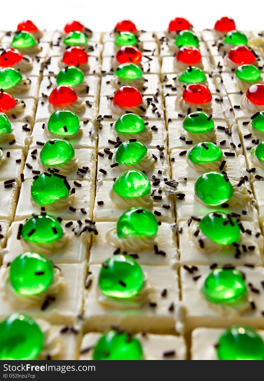 Isolates of cake squares with a green and red jelly on it greatly. Isolates of cake squares with a green and red jelly on it greatly.