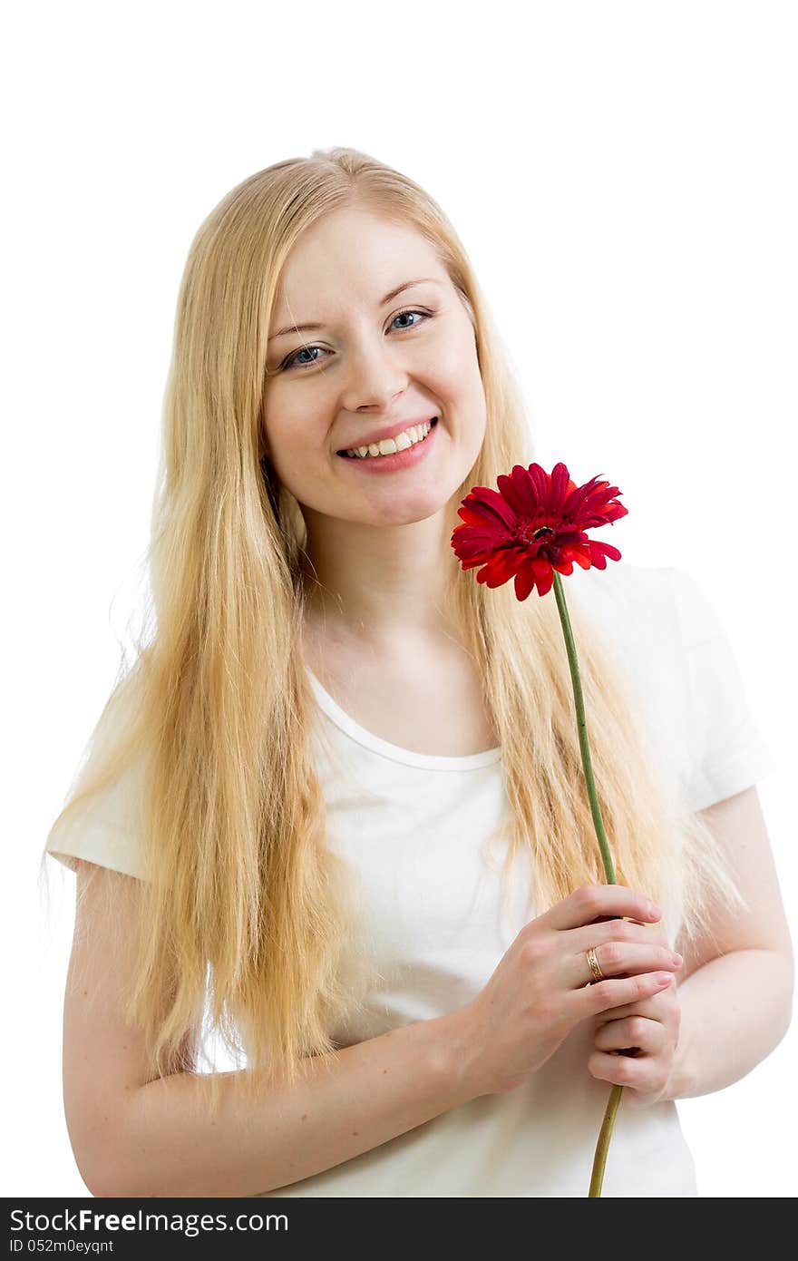 Portrait of a young happy woman with flower