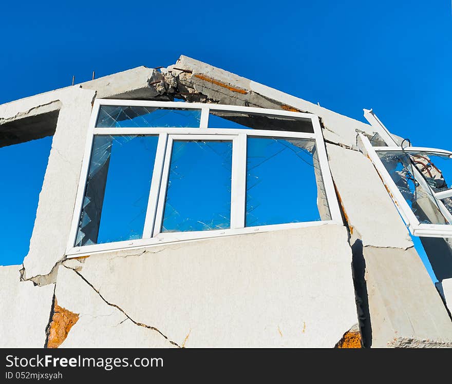 Destroyed house against the blue sky. Destroyed house against the blue sky