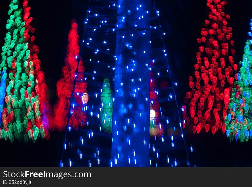 Abstract christmas trees out of focus at night. Abstract christmas trees out of focus at night