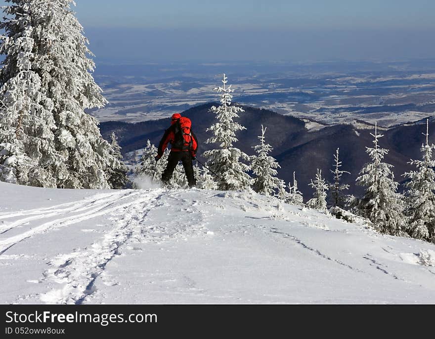 Skier getting down from the mountain