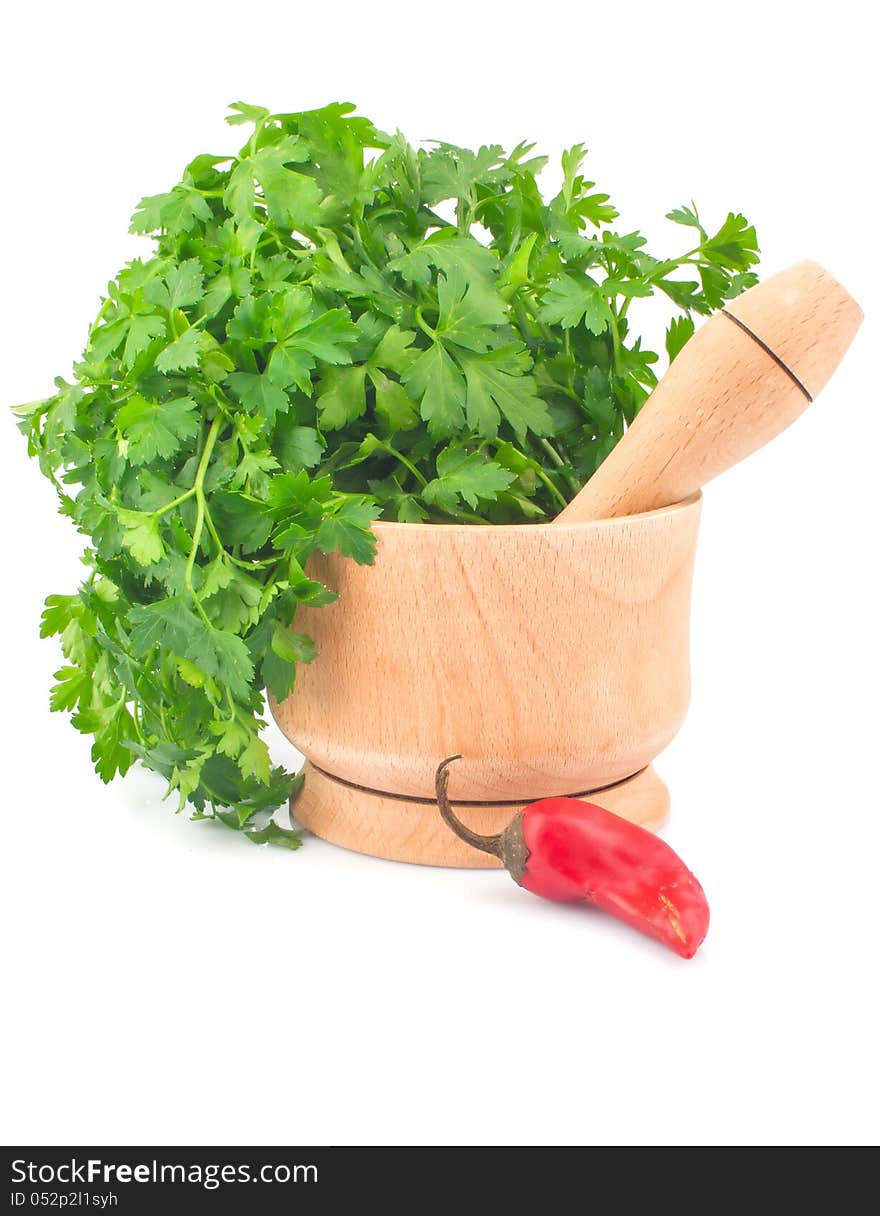 Parsley in mortar and chili pepper