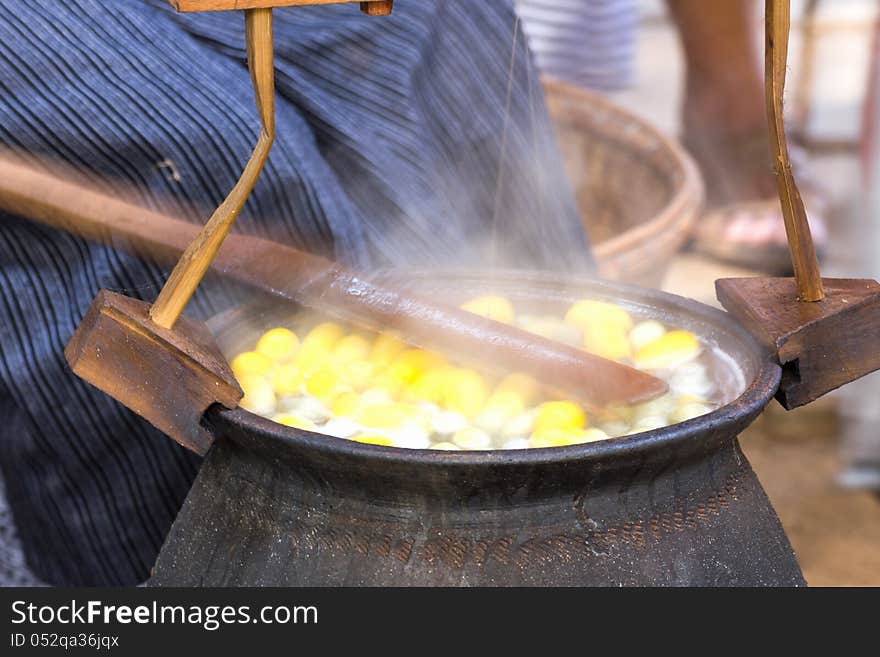 Boiling cocoon in a pot to prepare a cocoon silk.