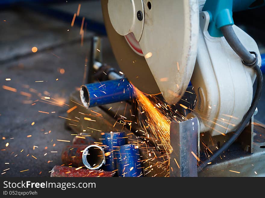 Closeup cutting steel with grinder