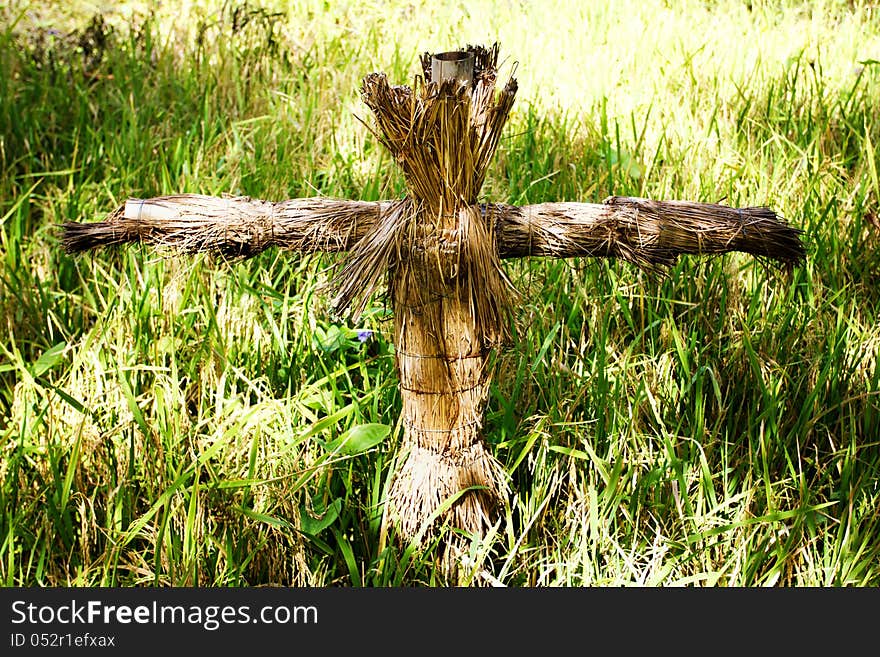 Scarecrow in a grass