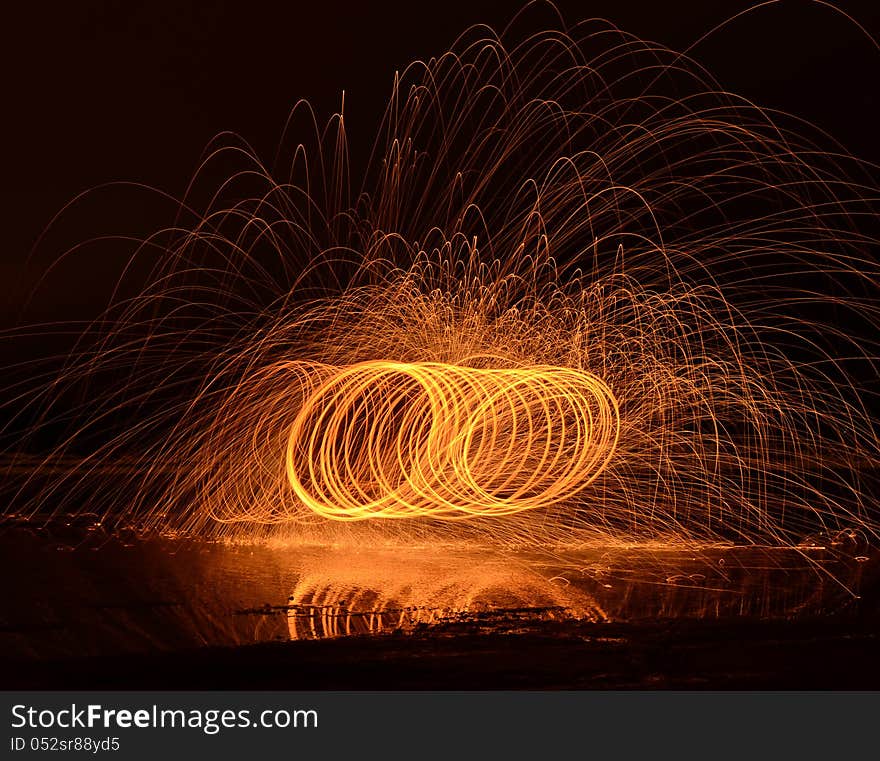 Fire streaks with water reflection