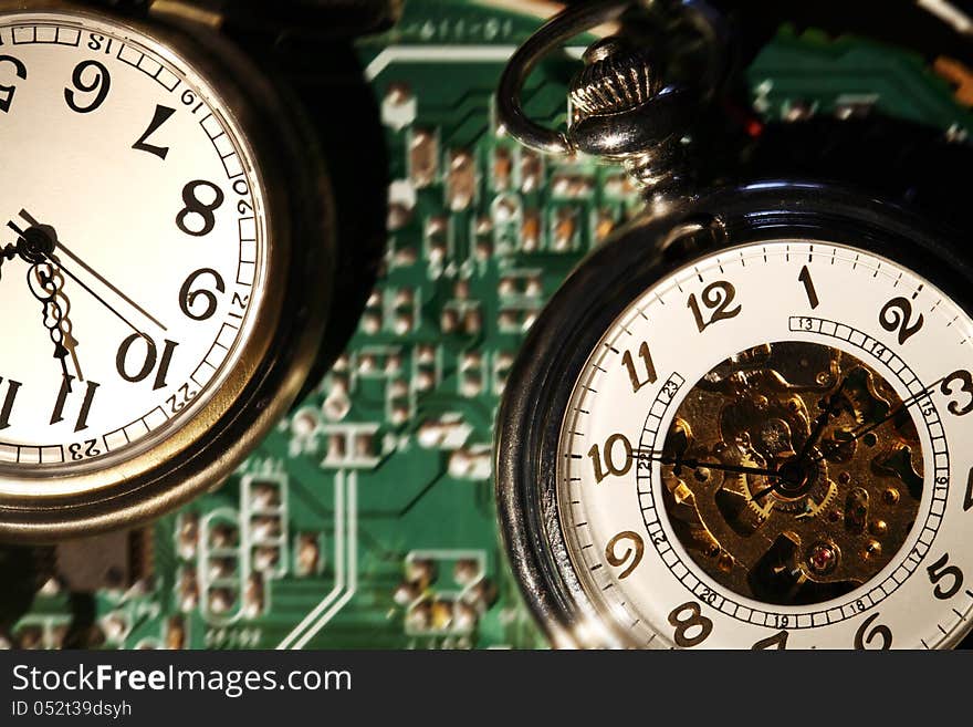 Closeup of watches on abstract green technology background. Closeup of watches on abstract green technology background