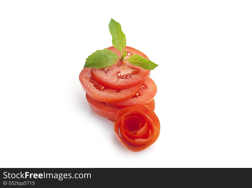 Fresh tomato splices on white background.