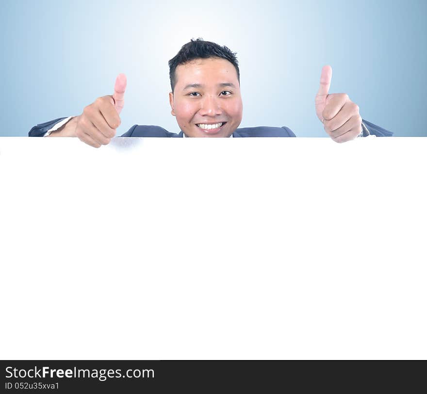 Business man holding white board with thumb up