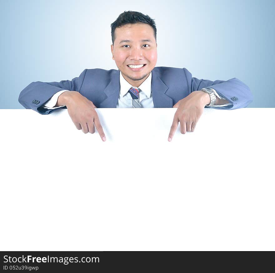 Business man holding white board template