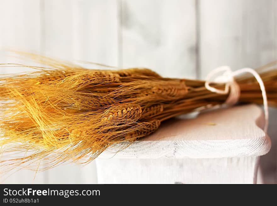 Photo of wheat on wooden background