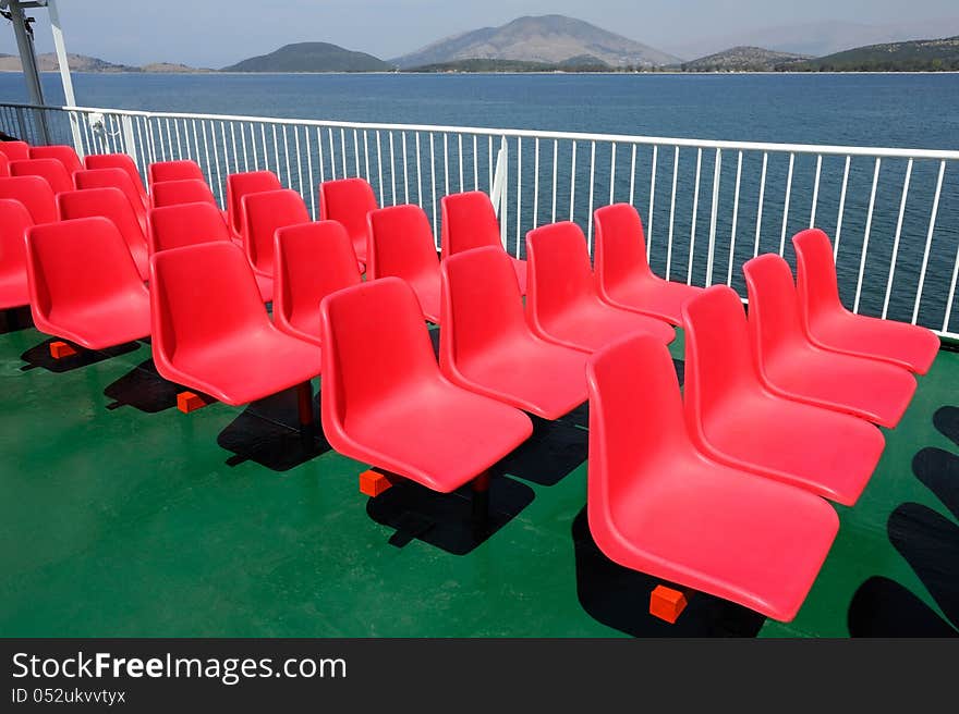 Red stadium chair on the boat deck. Red stadium chair on the boat deck