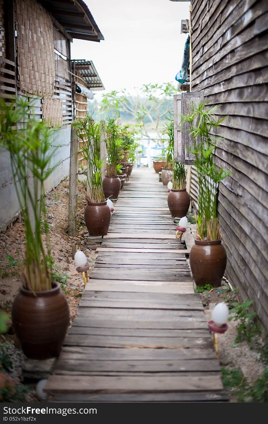 Little wooden street between two house. Little wooden street between two house