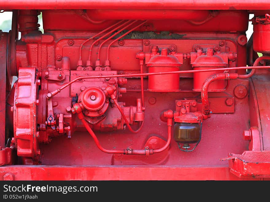 Some Old Tractor Engine Parts were painted red.