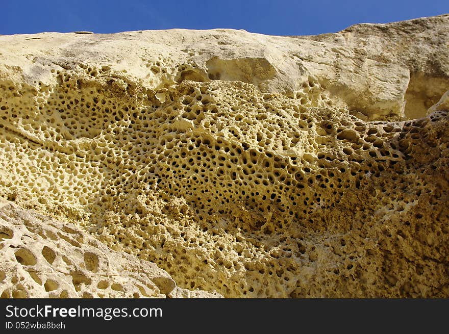 Weathered sandstone with holes near train station Nevsha, Bulgaria. Weathered sandstone with holes near train station Nevsha, Bulgaria