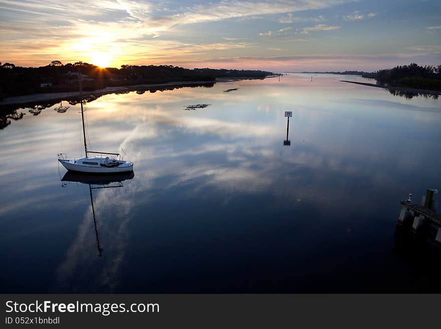 Sunrise with sailboat at Manasota Bridge, Florida