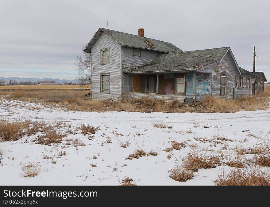 An old empty farm house in a field in Colorado. An old empty farm house in a field in Colorado.