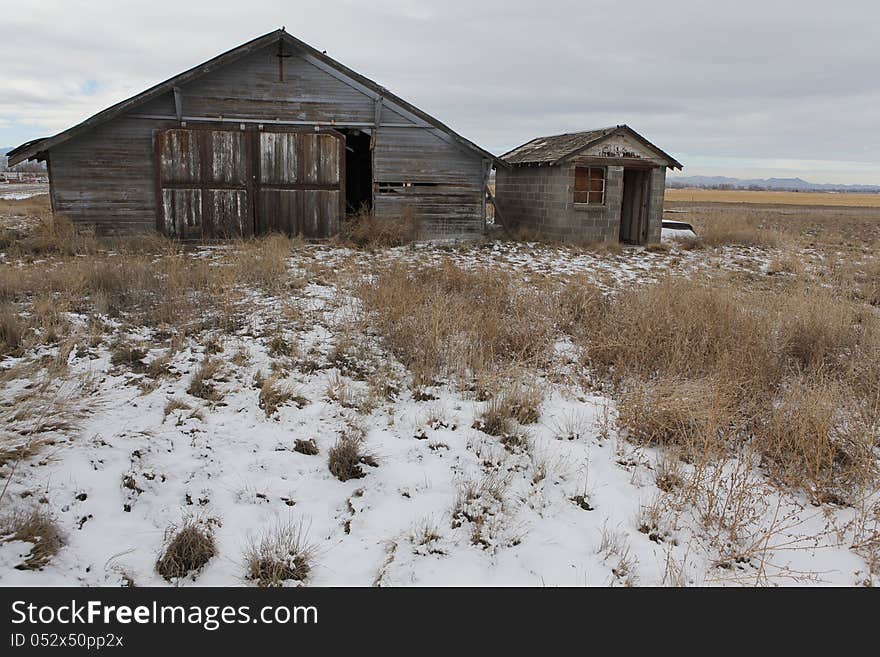 Old farmers garage in a field in Colorado. Old farmers garage in a field in Colorado.