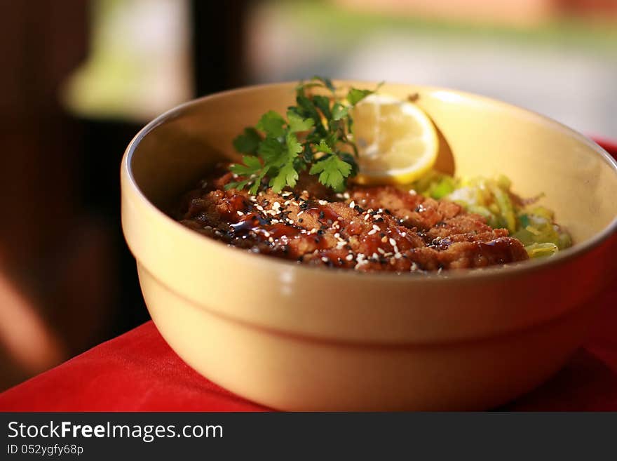 Chinese food on oriental plate.