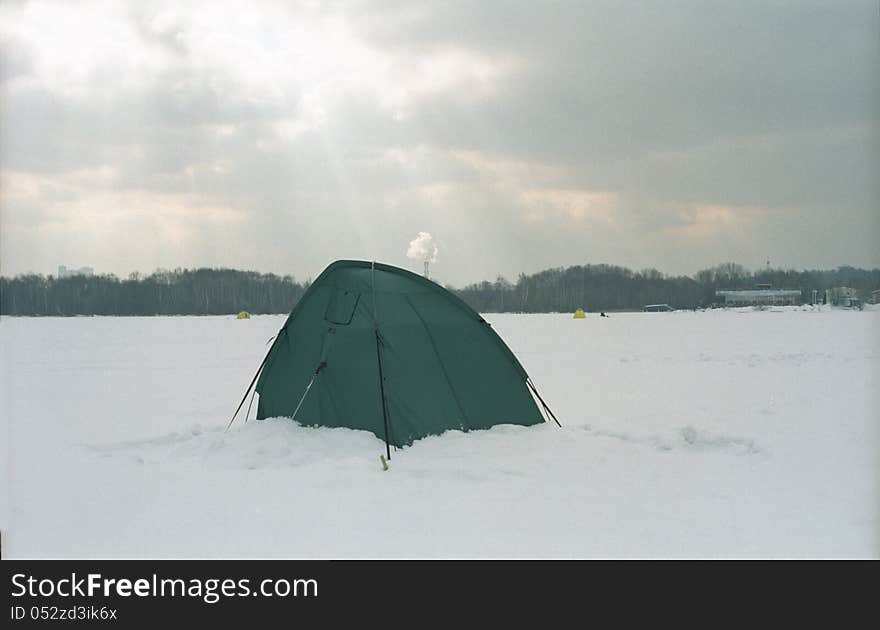 Fisherman`s tent on an iced lake. Fisherman`s tent on an iced lake