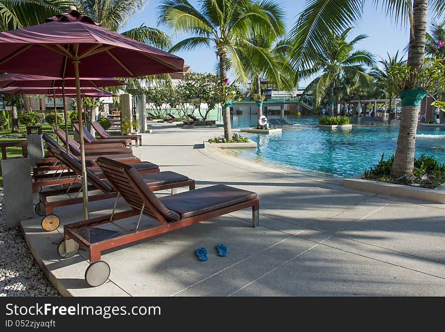 Empty pool bed along swimming pool of beautiful resort