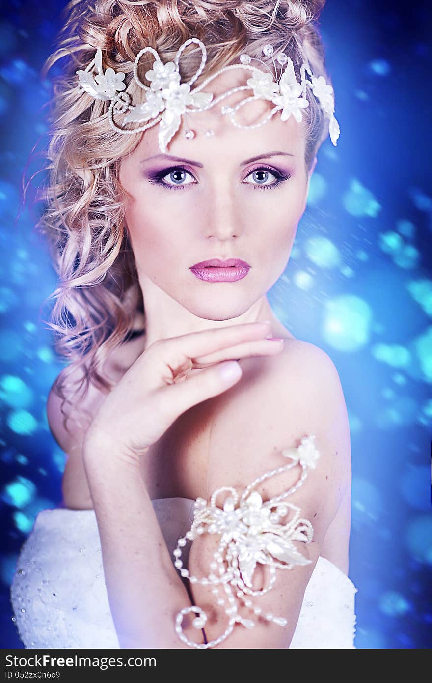 Portrait of a beautiful young bride in a white dress