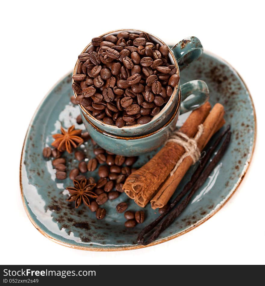 Coffee beans and spices on a white background