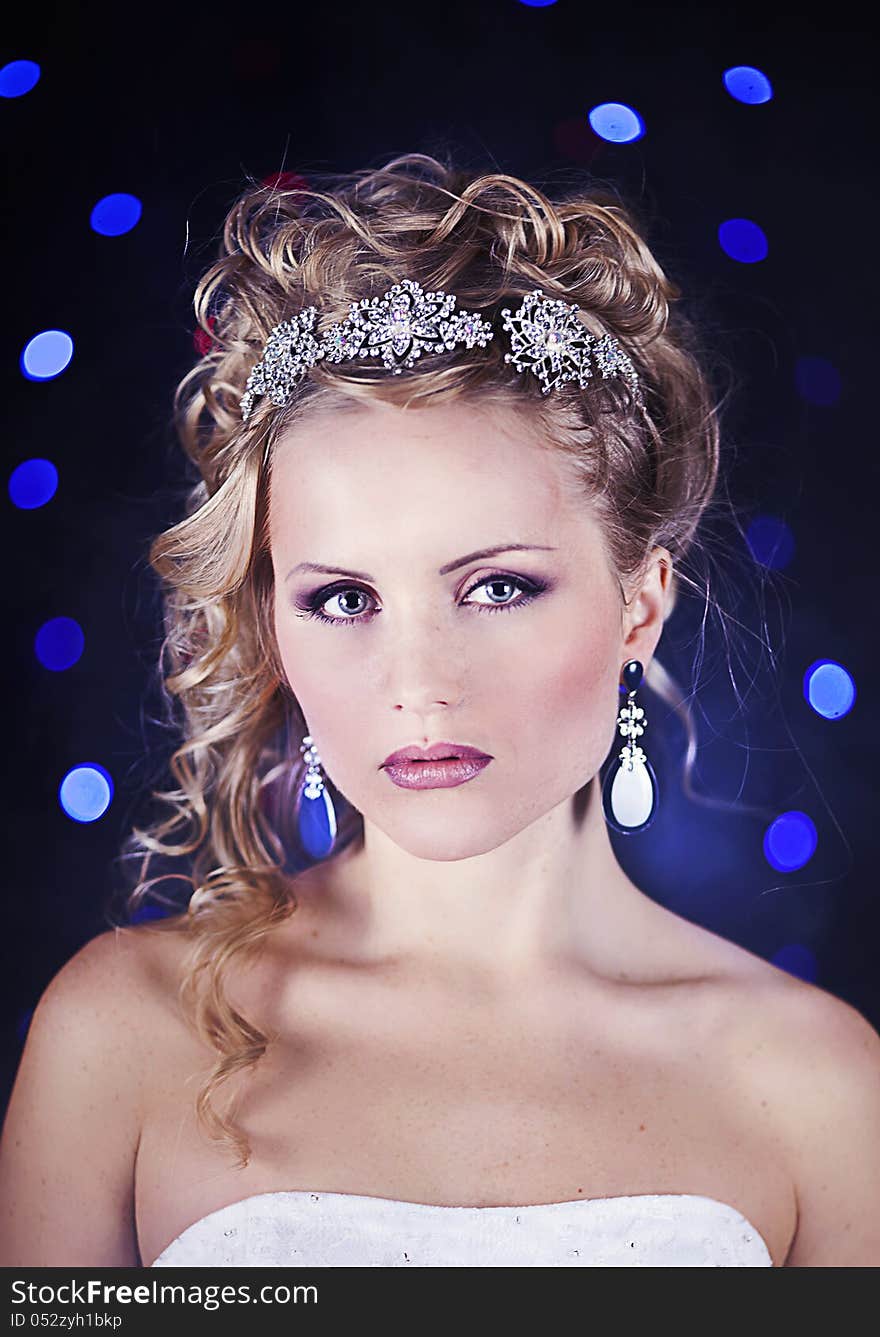 Portrait of a beautiful young bride in a white dress