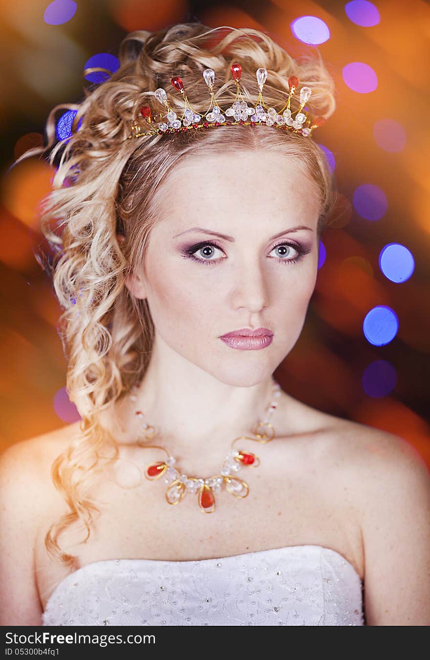 Portrait of a beautiful young bride in a white dress