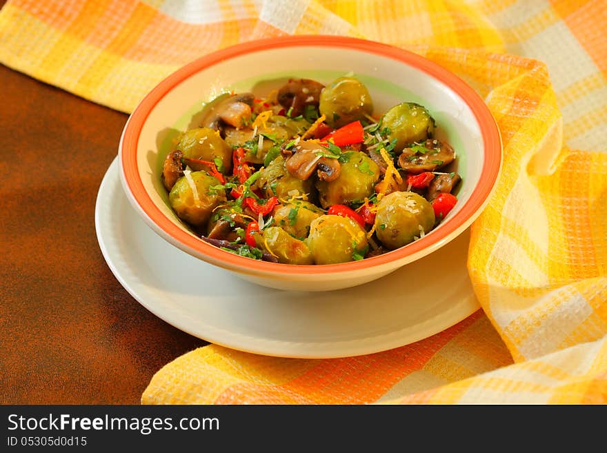 Vegetarian dish with brussels sprouts, mushrooms and red peppers