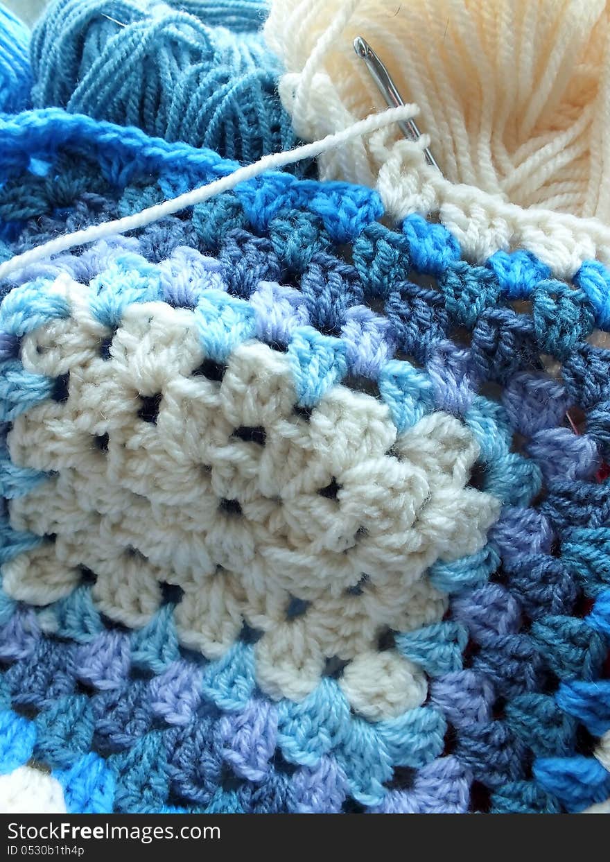 Hand crocheted afghan blue and cream crochet blanket. Hand crocheted afghan blue and cream crochet blanket