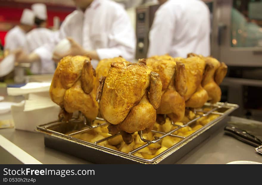 Grilled chicken on restaurant kitchen