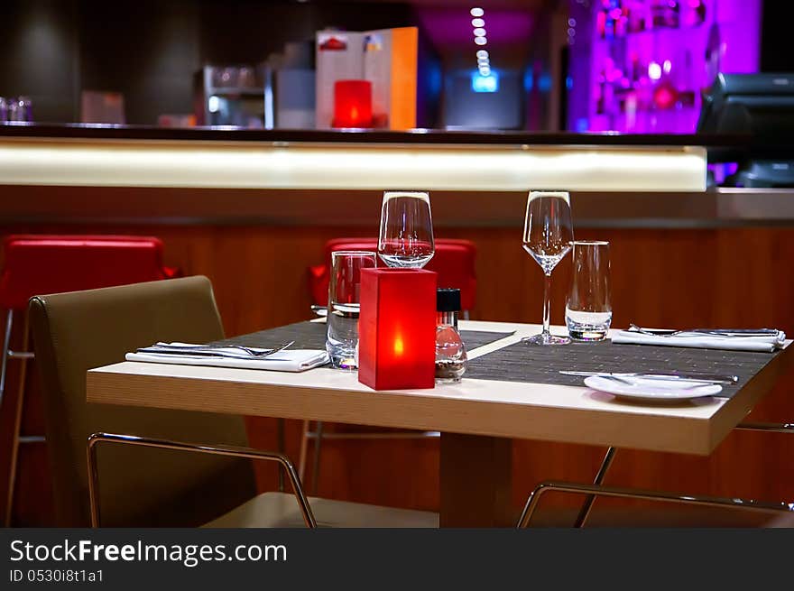 Red candle on table inevening restaurant. Red candle on table inevening restaurant