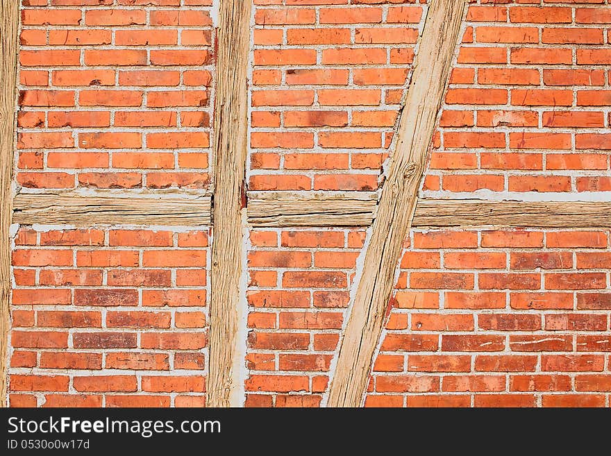 Old Red Brick Wall With Wooden Beams As Background