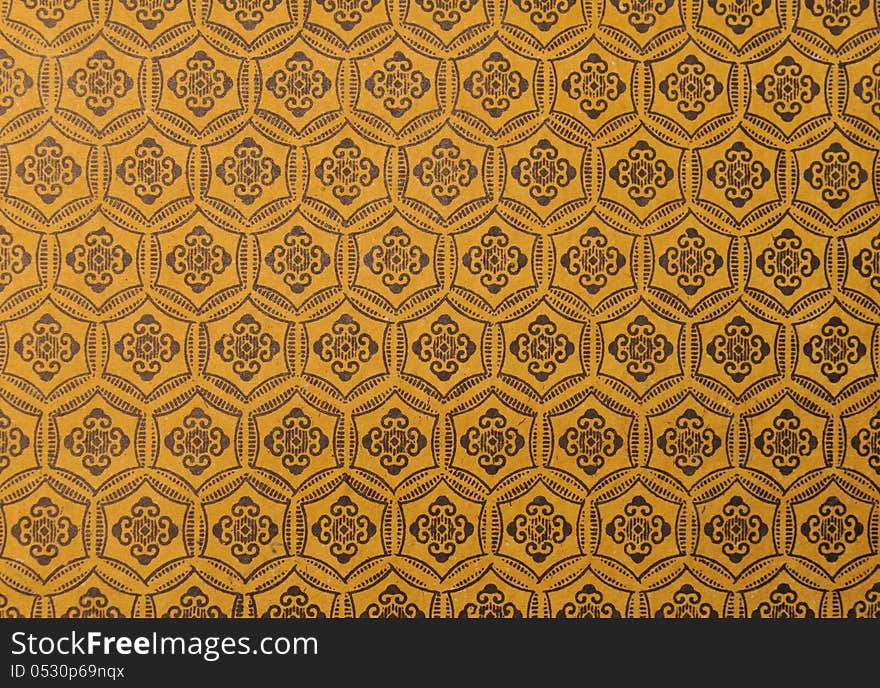 Background with pattern of curlicues on yellow background. Background with pattern of curlicues on yellow background