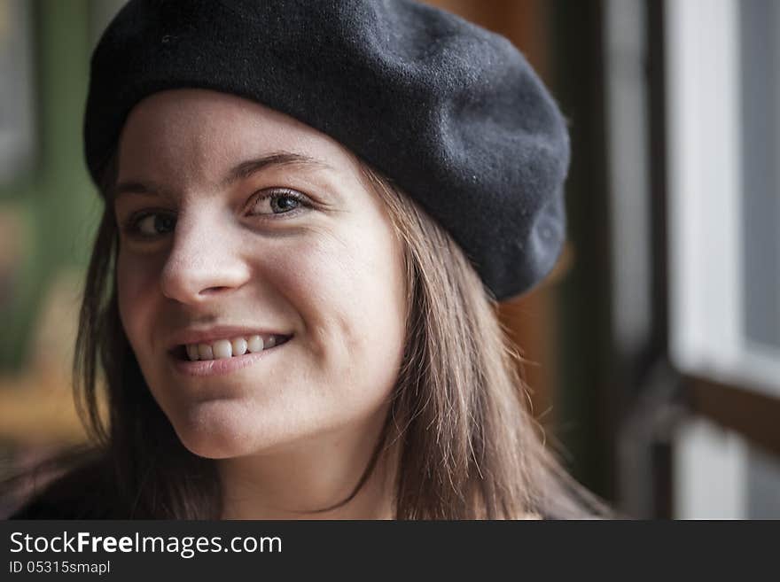 Portrait of a young woman staring straight ahead into the camera. Portrait of a young woman staring straight ahead into the camera