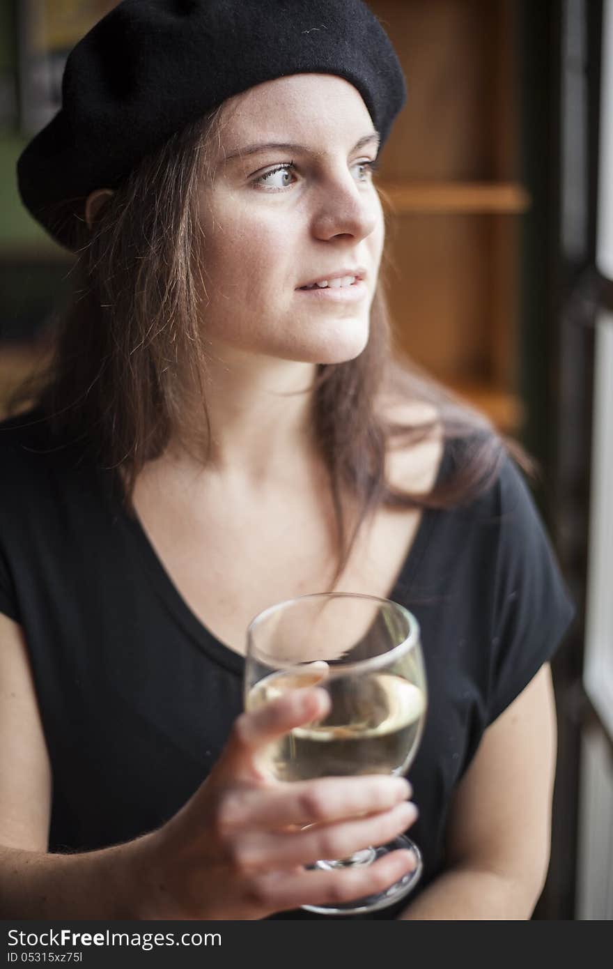 Portrait of a young woman with white wine. Portrait of a young woman with white wine.