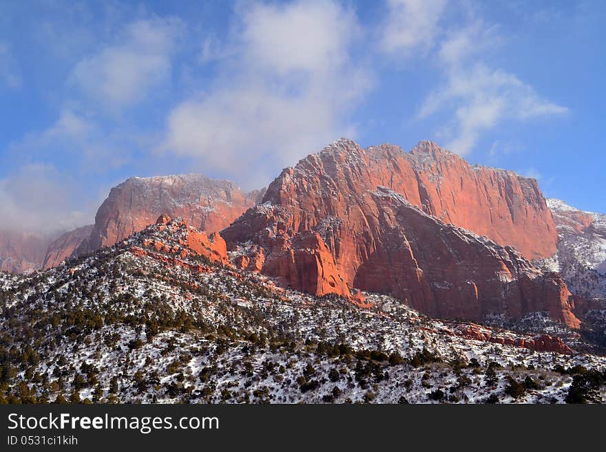 A winter scene of snow and red rocks in Utah. A winter scene of snow and red rocks in Utah.