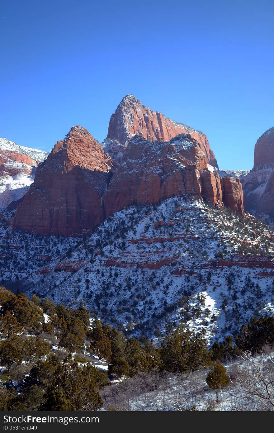 A winter scene of snow and red rocks in Utah. A winter scene of snow and red rocks in Utah.