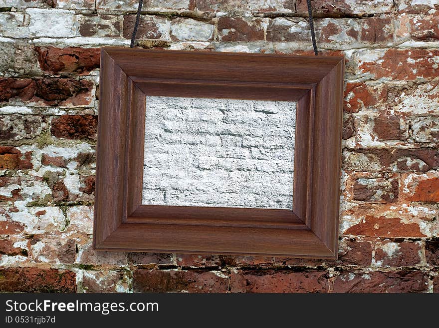 Painting in wooden frame hanging on an old brick wall. Painting in wooden frame hanging on an old brick wall