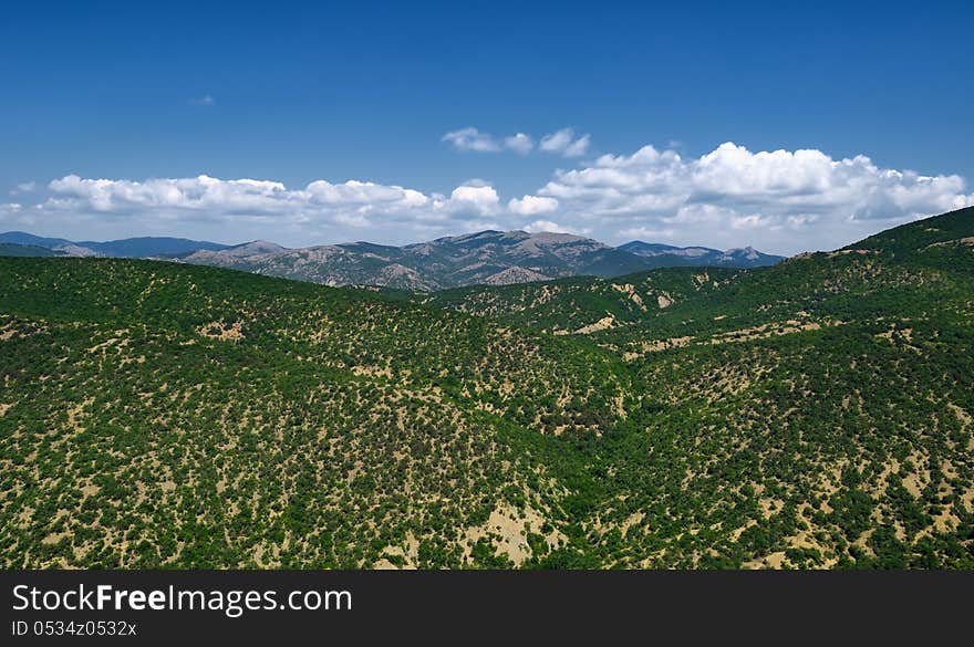 The landscape from the green mountains and blue cloudy sky in Crimea. The landscape from the green mountains and blue cloudy sky in Crimea