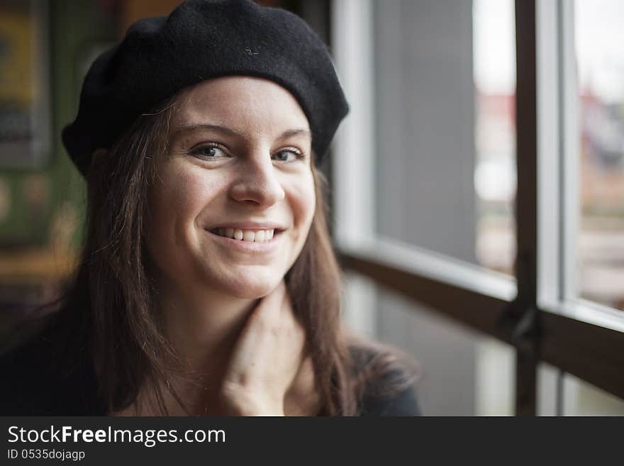 Portrait of a young woman staring straight ahead into the camera. Portrait of a young woman staring straight ahead into the camera