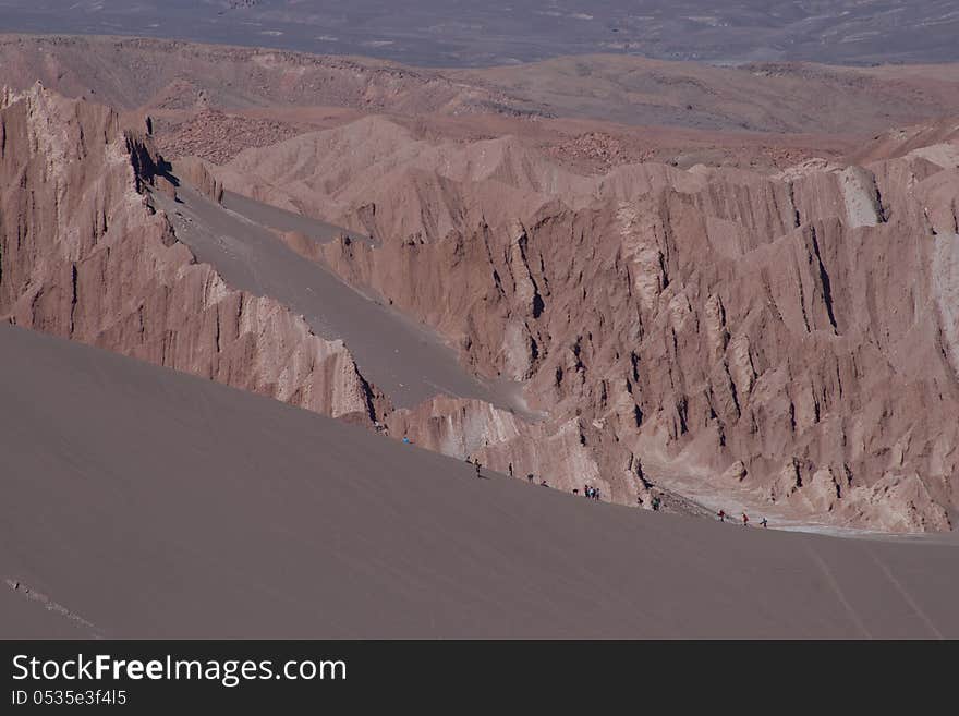 Sand-boarders surf the sands of the Atacama Desert. Sand-boarders surf the sands of the Atacama Desert.