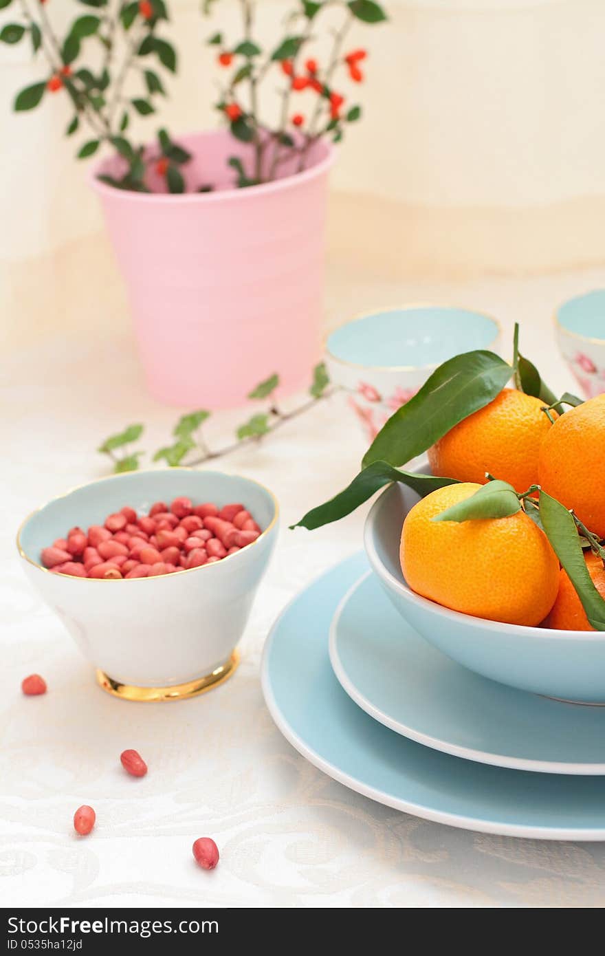 Ripe clementines and red skin pinuts