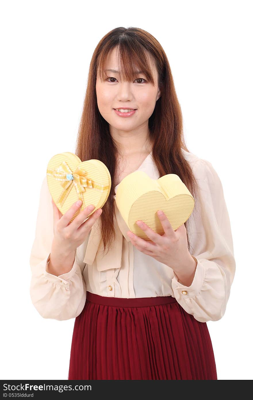 Young asian woman opening present