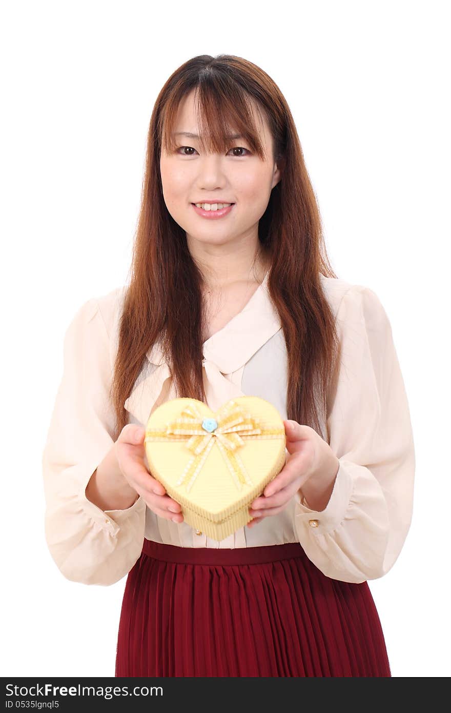 Young asian woman holding a gift box on white background