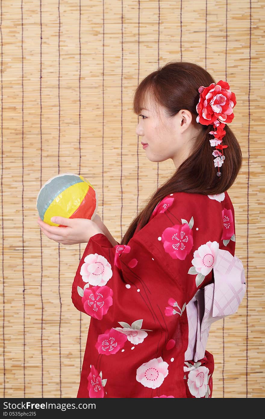 Profile of young asian woman in traditional clothes of kimono with paper balloon