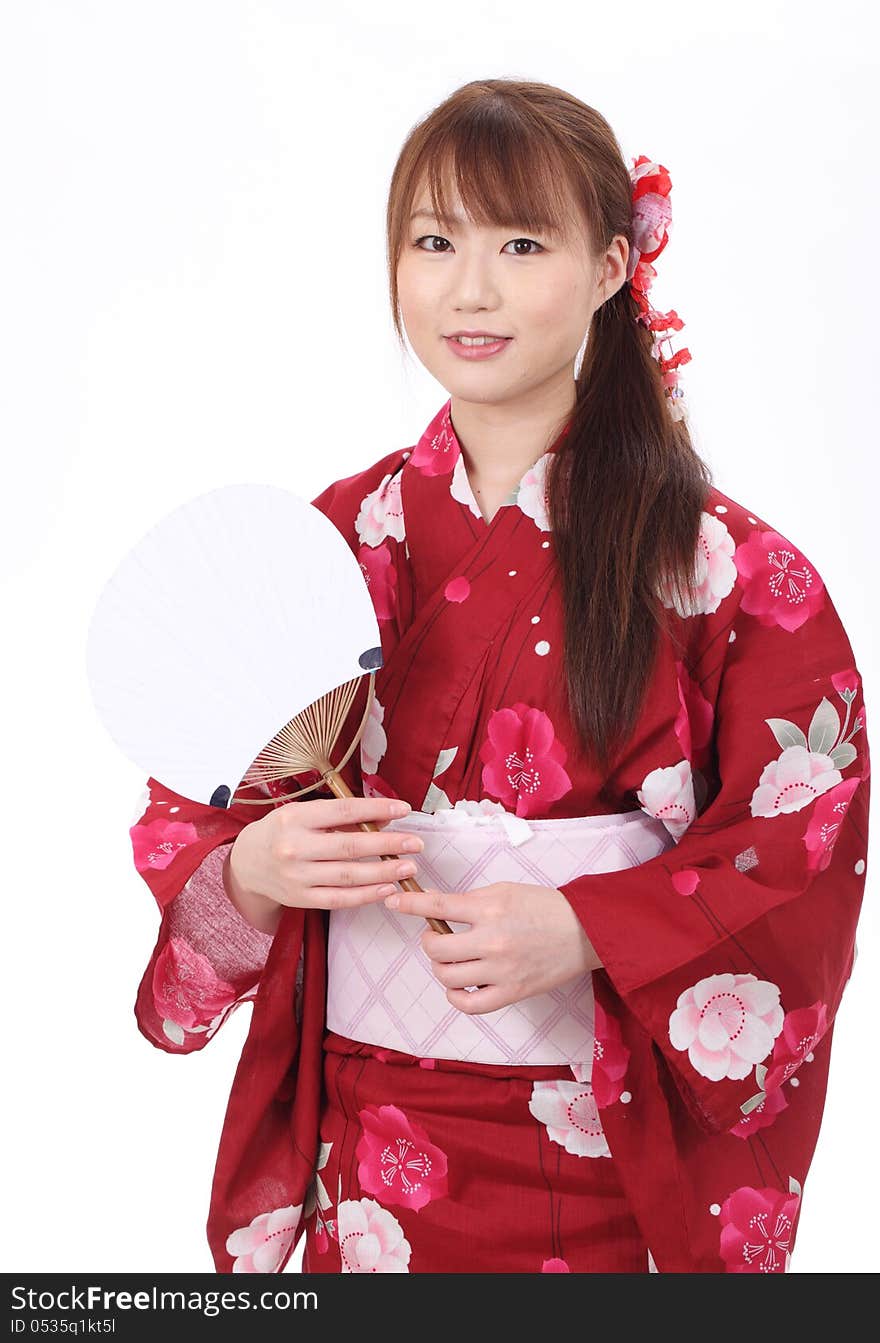 Young asian woman in traditional clothes of kimono with paper fan. Young asian woman in traditional clothes of kimono with paper fan